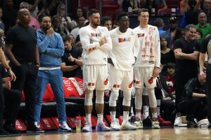 Miami Heat guard Max Strus, left, guard Victor Oladipo, center, and forward Duncan Robinsonm, right, watch during the closest seconds of an NBA basketball game against the San Antonio Spurs, Saturday, Dec. 10, 2022, in Miami. The Spurs won 115-111. (AP Photo/Lynne Sladky) - Media by Associated Press