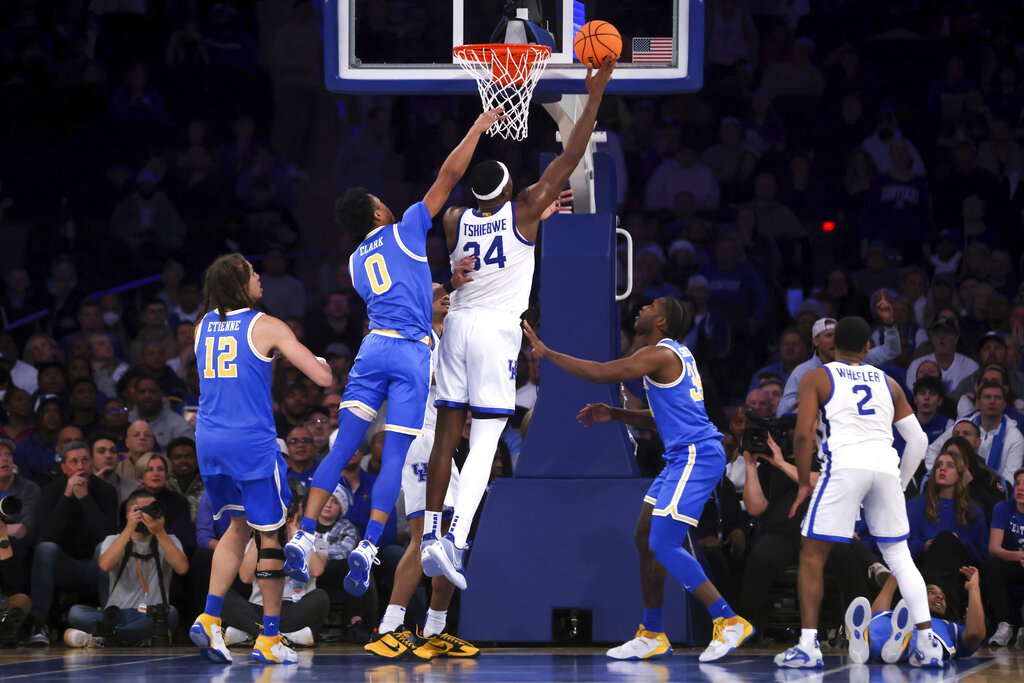 Media by Associated Press - Kentucky forward Oscar Tshiebwe (34) attempts a layup during the second half of an NCAA college basketball game against UCLA in the CBS Sports Classic, Saturday, Dec. 17, 2022, in New York. The Bruins won 63-53. (AP Photo/Julia Nikhinson)