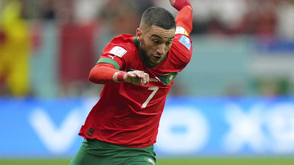 Media by Associated Press - Morocco's Hakim Ziyech in action during the World Cup semifinal soccer match between France and Morocco at the Al Bayt Stadium in Al Khor, Qatar, Wednesday, Dec. 14, 2022. (AP Photo/Francisco Seco)