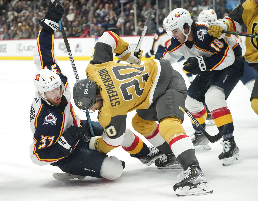 Media by Associated Press - Colorado Avalanche left wing J.T. Compher (37) and Vegas Golden Knights center Chandler Stephenson (20) in the third period of an NHL hockey game Monday, Jan. 2, 2023, in Denver. (AP Photo/David Zalubowski)