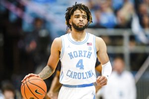 Media by Associated Press - North Carolina guard R.J. Davis (4) brings the ball up court against Notre Dame during an NCAA college basketball game on Saturday, Jan. 7, 2023, in Chapel Hill, N.C. (AP Photo/Jacob Kupferman)