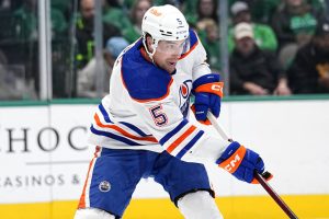 Media by Associated Press - Edmonton Oilers defenseman Cody Ceci (5) makes a pass during an NHL hockey game against the Dallas Stars, Wednesday, Dec. 21, 2022, in Dallas. (AP Photo/Tony Gutierrez)