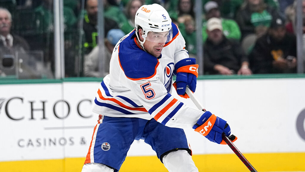 Media by Associated Press - Edmonton Oilers defenseman Cody Ceci (5) makes a pass during an NHL hockey game against the Dallas Stars, Wednesday, Dec. 21, 2022, in Dallas. (AP Photo/Tony Gutierrez)