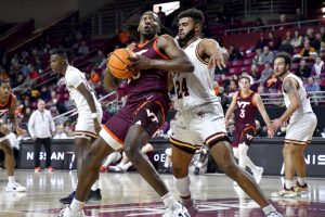 Media by Associated Press - Virginia Tech's Justyn Mutts attempts to score under defensive pressure from Boston College's Jonathan Noel (24) during the first half of an NCAA college basketball game, Wednesday, Dec. 21, 2022, in Boston. (AP Photo/Mark Stockwell)