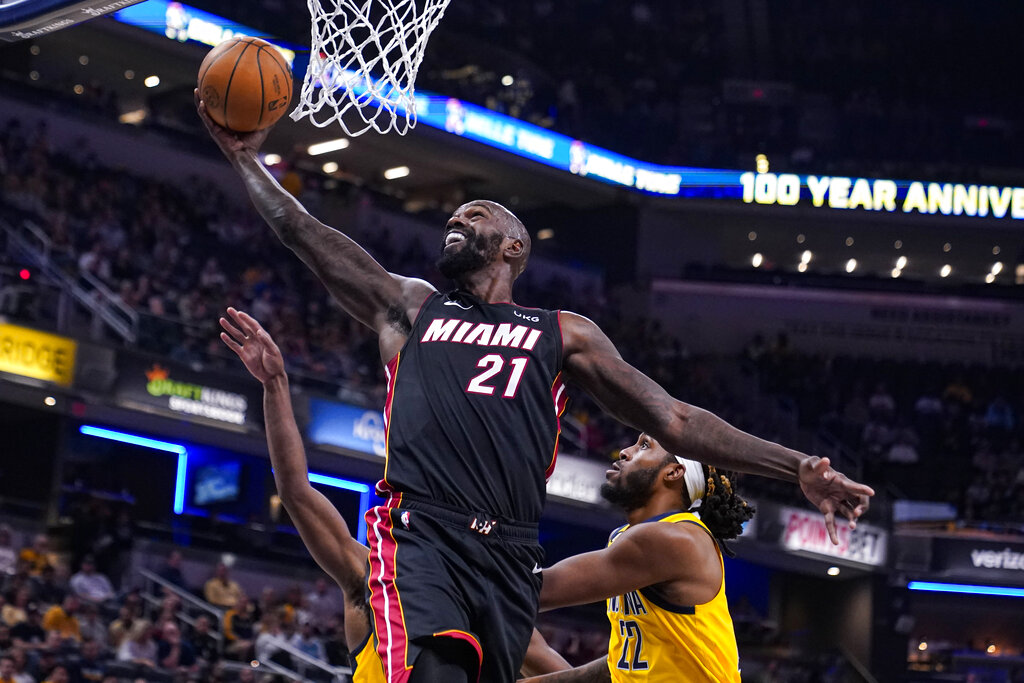 Media by Associated Press - FILE - Miami Heat center Dewayne Dedmon (21) shoots in front of Indiana Pacers guard Buddy Hield (24) and forward Isaiah Jackson (22) during the first half of an NBA basketball game in Indianapolis on Nov. 4, 2022. The Philadelphia 76ers signed veteran center Dewayne Dedmon, the team announced Tuesday, Feb 14, 2023 (AP Photo/Michael Conroy, File)