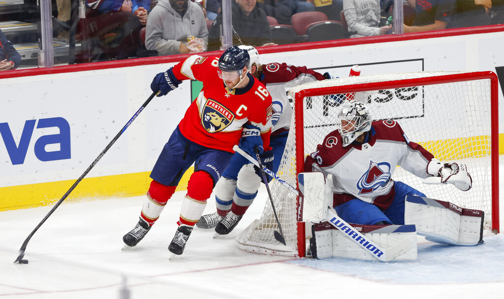 Media by Associated Press - Florida Panthers center Aleksander Barkov (16) drives the puck past Colorado Avalanche defenseman Bowen Byram (4) and goaltender Alexandar Georgiev (40) during the third period of an NHL hockey game Saturday, Feb. 11, 2023, in Sunrise, Fla. (AP Photo/Reinhold Matay)