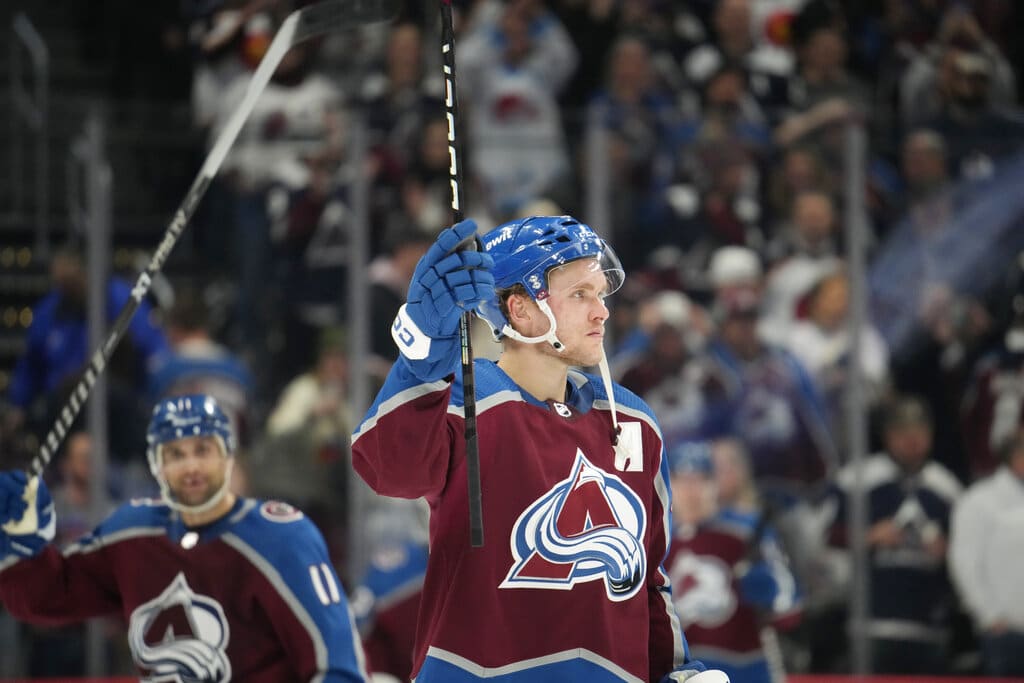 Media by Associated Press - Colorado Avalanche right wing Mikko Rantanen raises his stick to acknowledge the applause of fans after the team's NHL hockey game against the Calgary Flames on Saturday, Feb. 25, 2023, in Denver. (AP Photo/David Zalubowski)