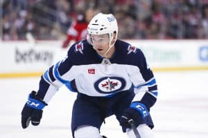 Media by Associated Press - Winnipeg Jets' Neal Pionk (4) during the second period of an NHL hockey game against the New Jersey Devils Sunday, Feb. 19, 2023, in Newark, N.J. (AP Photo/Frank Franklin II)