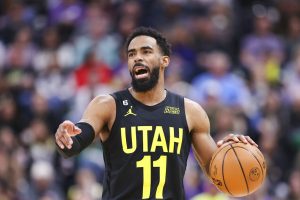 Media by Associated Press - Utah Jazz guard Mike Conley (11) dribbles the ball against the Dallas Mavericks in the first half of an NBA basketball game Saturday, Jan. 28, 2023, in Salt Lake City. (AP Photo/Rob Gray)