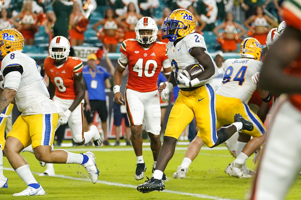 Media by Associated Press - Pittsburgh running back Israel Abanikanda (2) runs past Miami linebacker Caleb Johnson (40) for a touchdown during the first half of an NCAA college football game, Saturday, Nov. 26, 2022, in Miami Gardens, Fla. (AP Photo/Lynne Sladky)