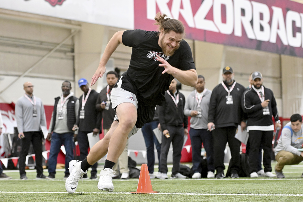 Media by Associated Press - Arkansas offensive lineman Dalton Wagner runs drills during NFL pro day Wednesday, March 29, 2023, in Fayetteville, Ark. (AP Photo/Michael Woods)