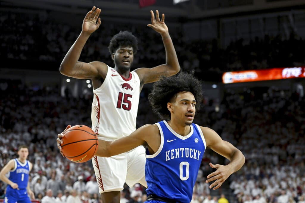 Media by Associated Press - Kentucky forward Jacob Toppin (0) tries to drive past Arkansas forward Makhi Mitchell (15) during an NCAA college basketball game Saturday, March 4, 2023, in Fayetteville, Ark. (AP Photo/Michael Woods)