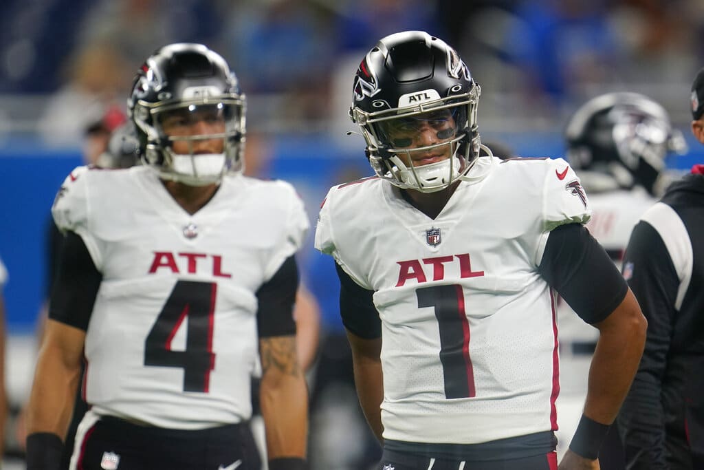 Media by Associated Press - FILE - Atlanta Falcons quarterbacks Marcus Mariota (1) and Desmond Ridder (4) prepare before a preseason NFL football game against the Detroit Lions in Detroit, Friday, Aug. 12, 2022. The Atlanta Falcons released quarterback Marcus Mariota on Tuesday, Feb. 28, 2023, in a move that was expected after the veteran was benched late in the 2022 season.The Falcons were 5-8 with Mariota as the starter before rookie Desmond Ridder started the final four games, winning two. (AP Photo/Paul Sancya, FILE)