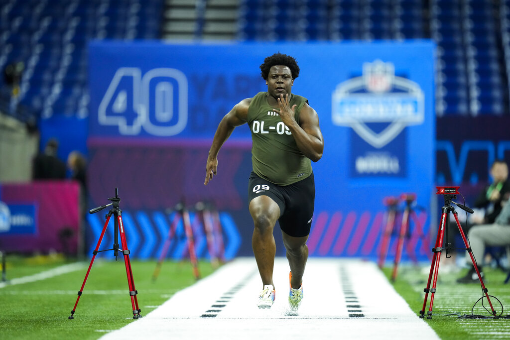 Media by Associated Press - Pittsburgh defensive lineman Calijah Kancey runs the 40-yard dash at the NFL football scouting combine in Indianapolis, Thursday, March 2, 2023. (AP Photo/Michael Conroy)