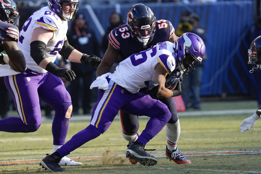 Media by Associated Press - Minnesota Vikings running back Kene Nwangwu (26) is tackled by Chicago Bears linebacker Nicholas Morrow (53) during the second half of an NFL football game, Sunday, Jan. 8, 2023, in Chicago. (AP Photo/Nam Y. Huh)