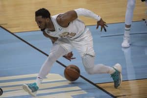 Media by Associated Press - Cleveland Cavaliers' Donovan Mitchell (45) tries to keep the ball in bounds against the Washington Wizards during an NBA basketball game in Cleveland, Friday, March 17, 2023. (AP Photo/Phil Long)