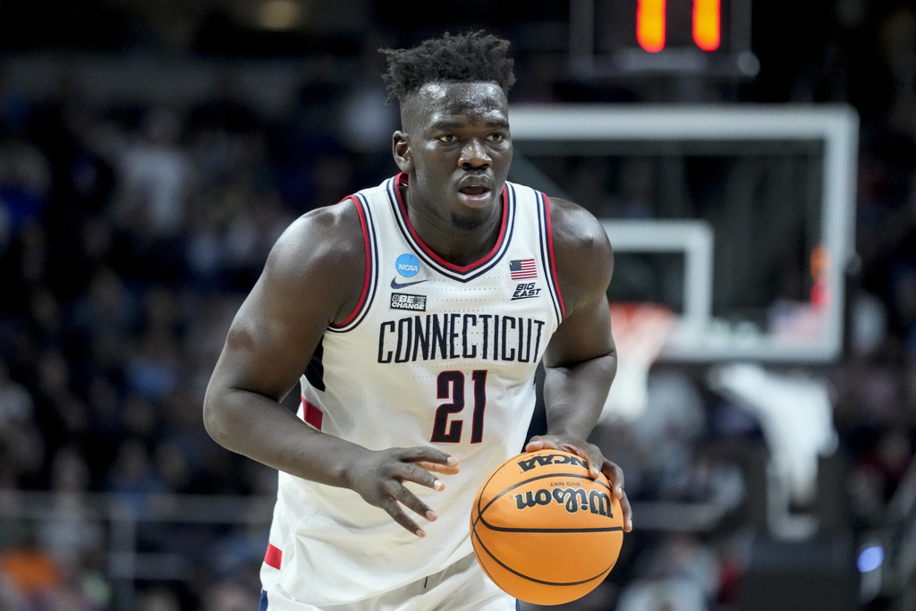 Media by Associated Press - UConn's Adama Sanogo (21) dribbles up the court in the second half of a second-round college basketball game against Saint Mary's in the NCAA Tournament, Sunday, March 19, 2023, in Albany, N.Y. (AP Photo/John Minchillo)