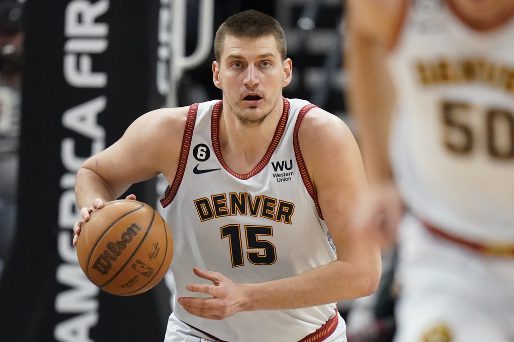 Media by Associated Press - Denver Nuggets center Nikola Jokic (15) brings the ball up court during the first half of an NBA basketball game against the Utah Jazz, Saturday, April 8, 2023, in Salt Lake City. (AP Photo/Rick Bowmer)